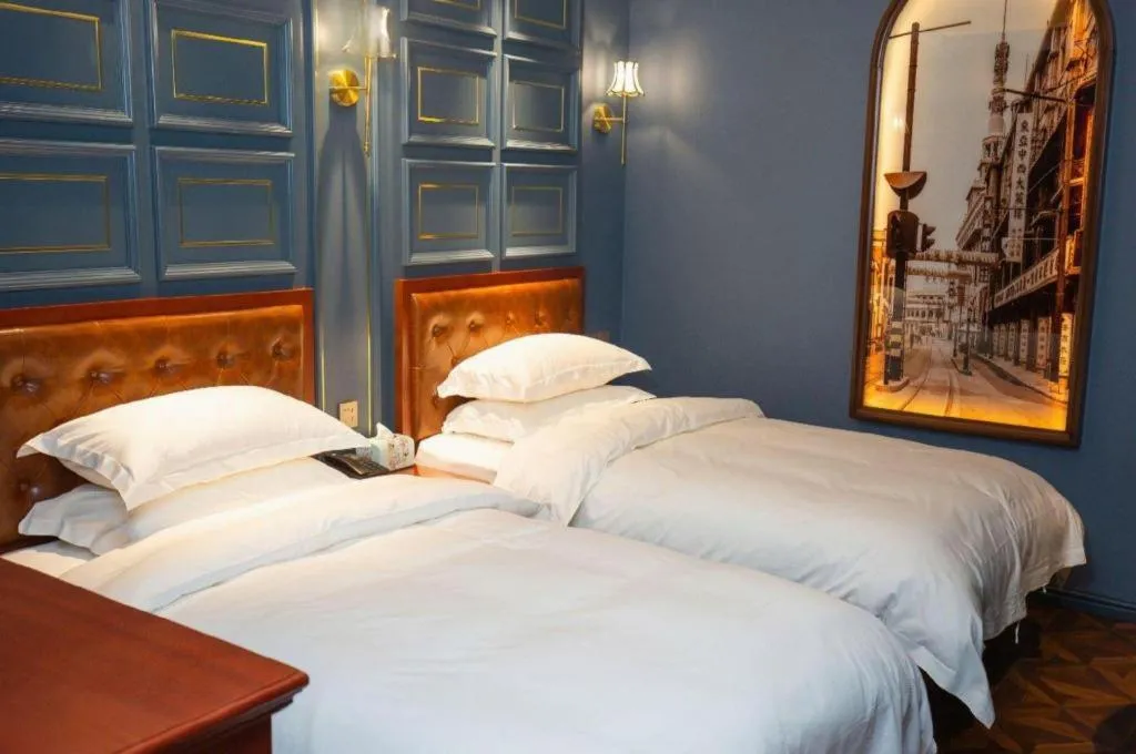 Bed in Yitingzhenshe Hotel Beijing Qianmen