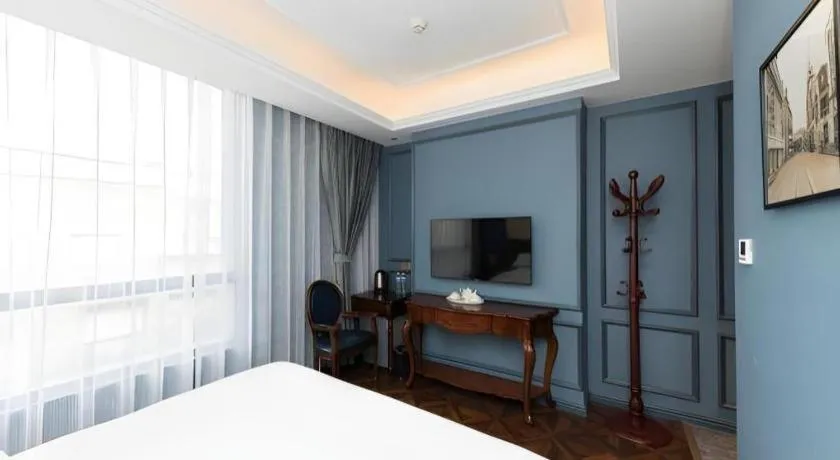 Bed in Yitingzhenshe Hotel Beijing Qianmen