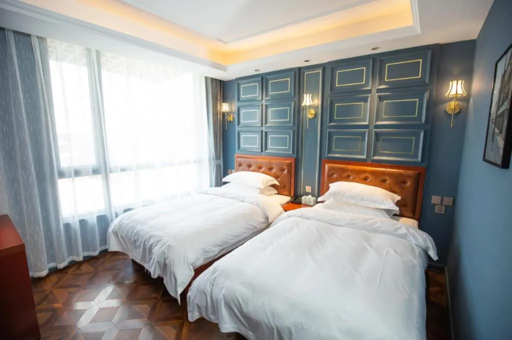 Bed in Yitingzhenshe Hotel Beijing Qianmen