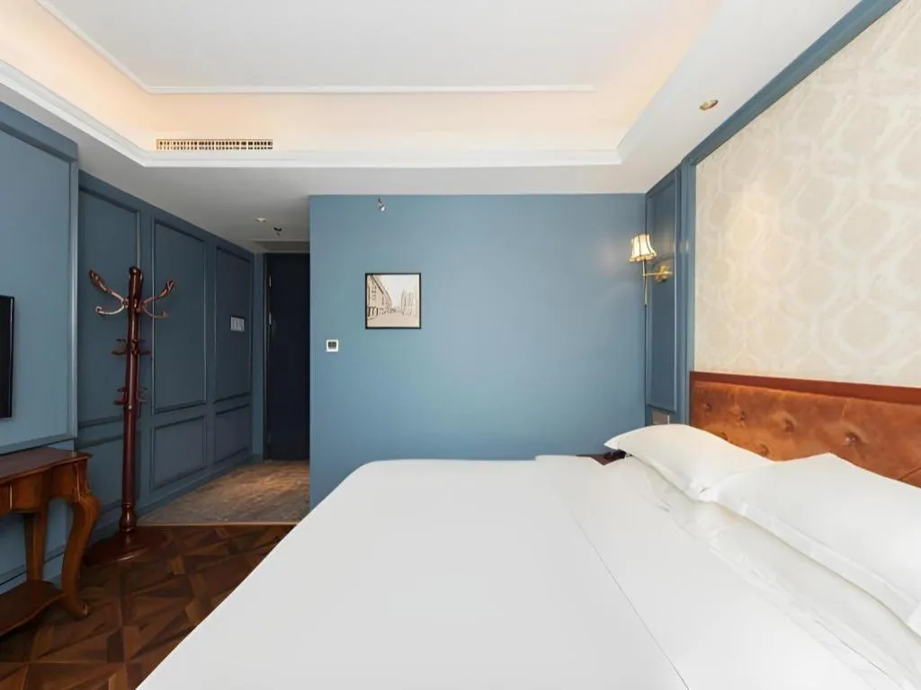 Bed in Yitingzhenshe Hotel Beijing Qianmen