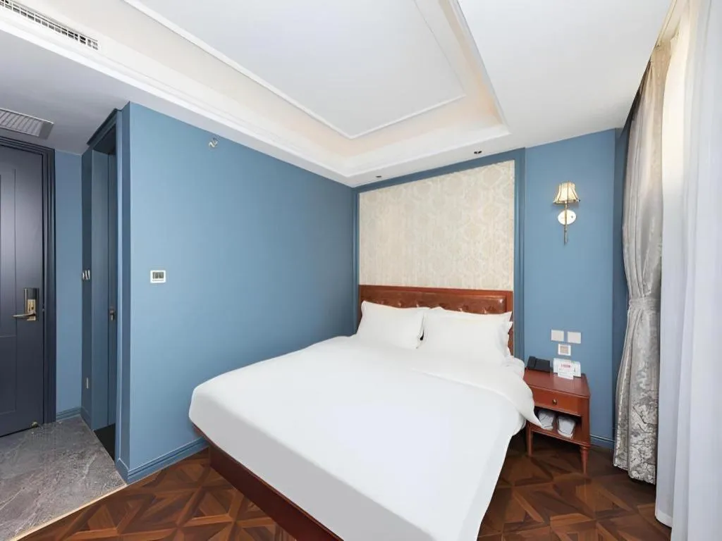 Bed in Yitingzhenshe Hotel Beijing Qianmen