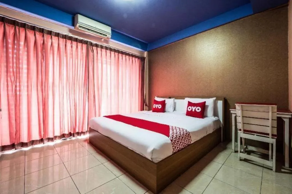 Bed in OYO 826 Cozy Rooms