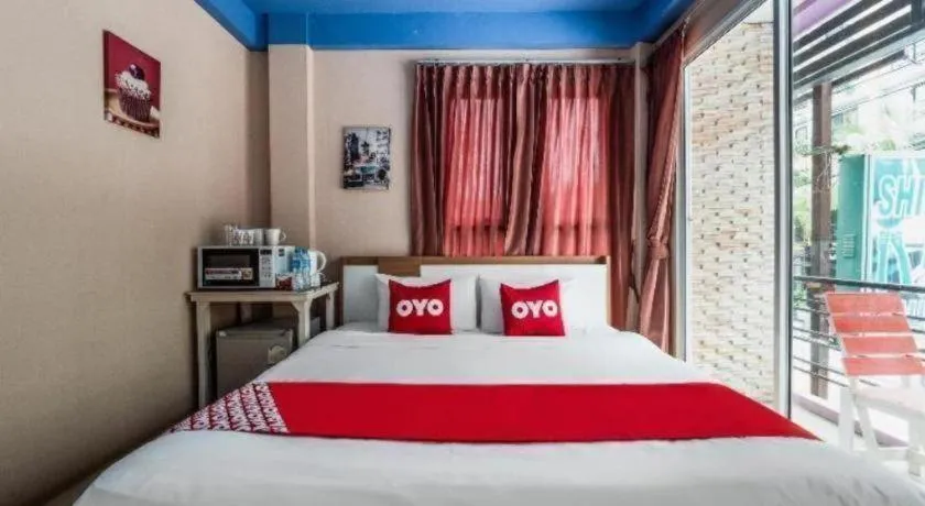 Bed in OYO 826 Cozy Rooms