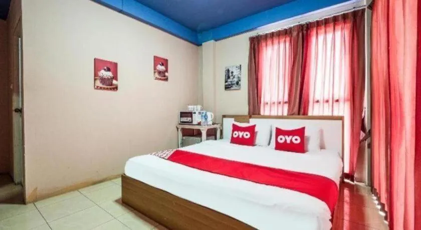 Bed in OYO 826 Cozy Rooms