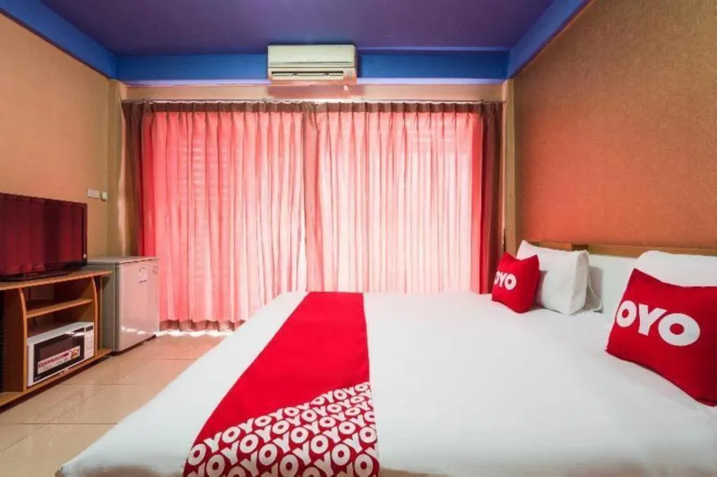 Bed in OYO 826 Cozy Rooms