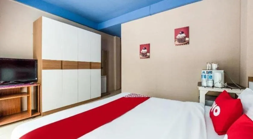 Bed in OYO 826 Cozy Rooms