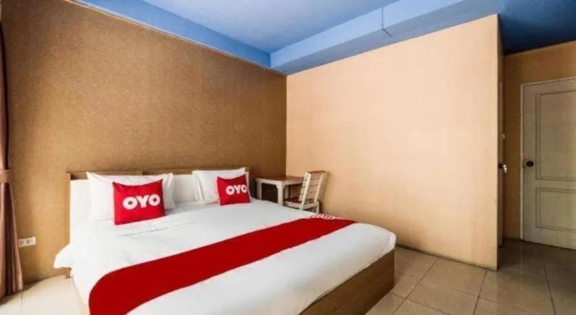 Bed in OYO 826 Cozy Rooms