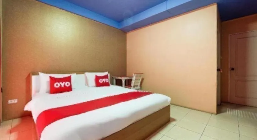 Bed in OYO 826 Cozy Rooms