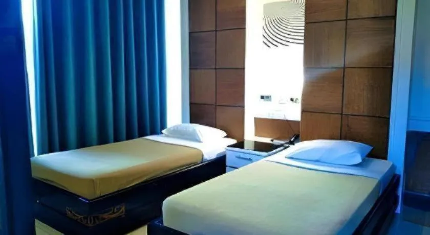 Bed in Marcian Business Hotel