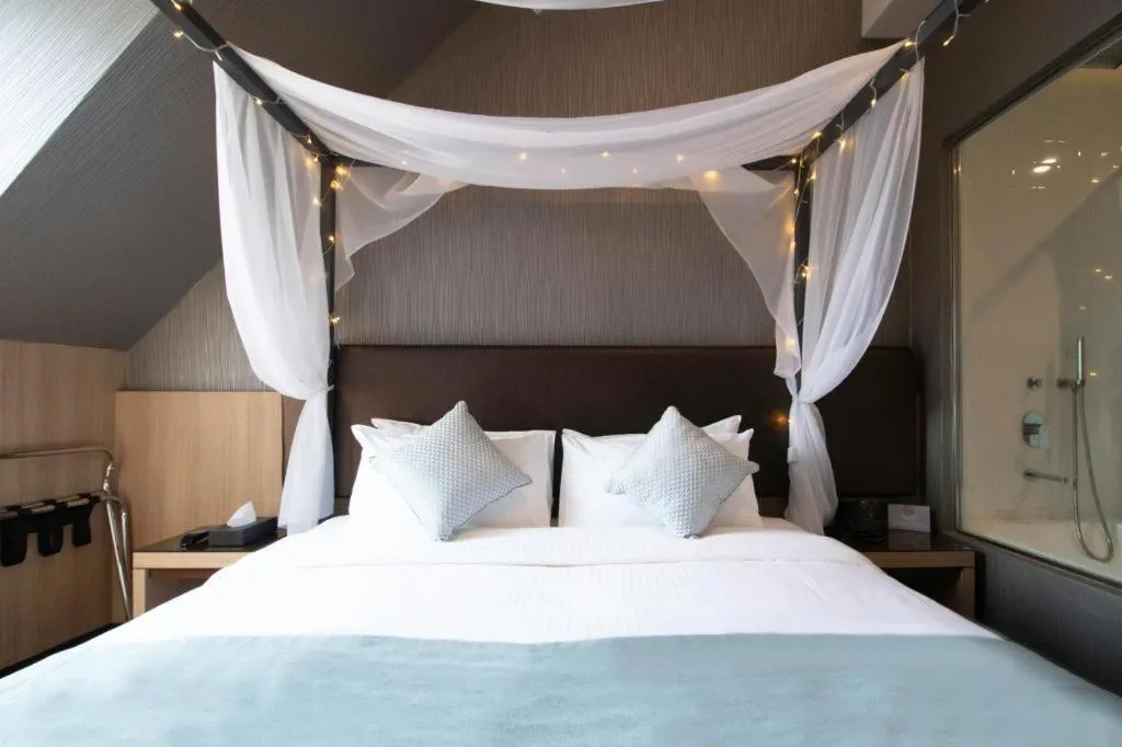 Bed in Hotel NuVe Stellar