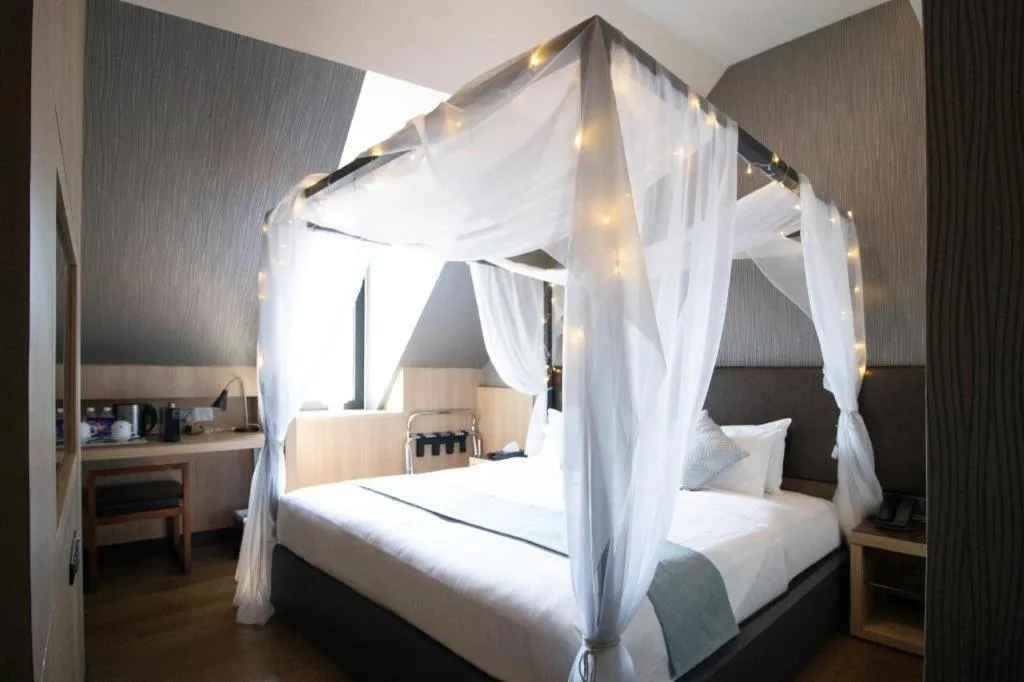 Bed in Hotel NuVe Stellar