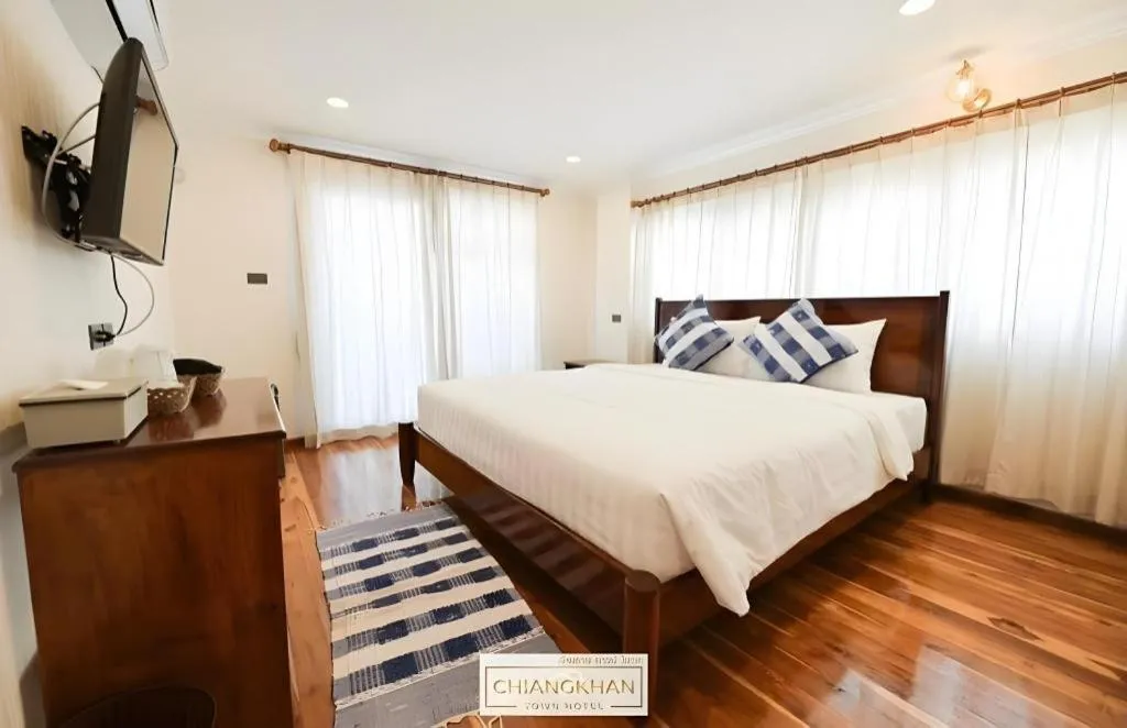 Bed in Chiangkhan Town Hotel