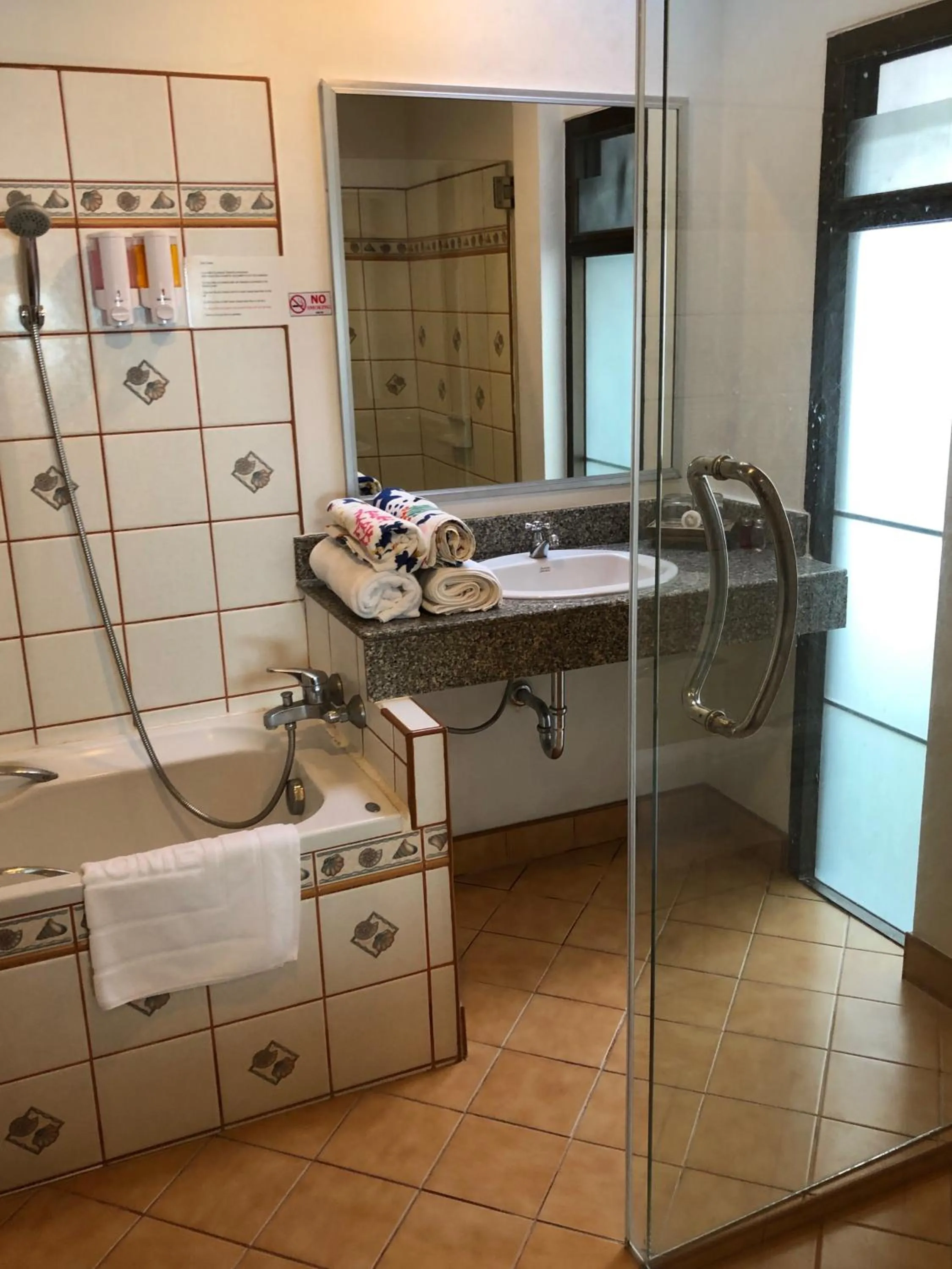 Shower in Noble House Beach Resort