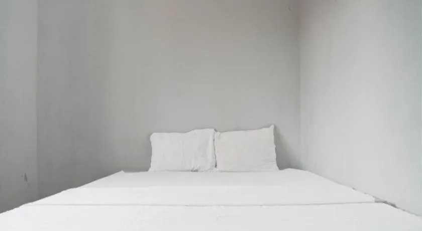 Bed in Hotel O Home Stay Syariah Aom Kusman
