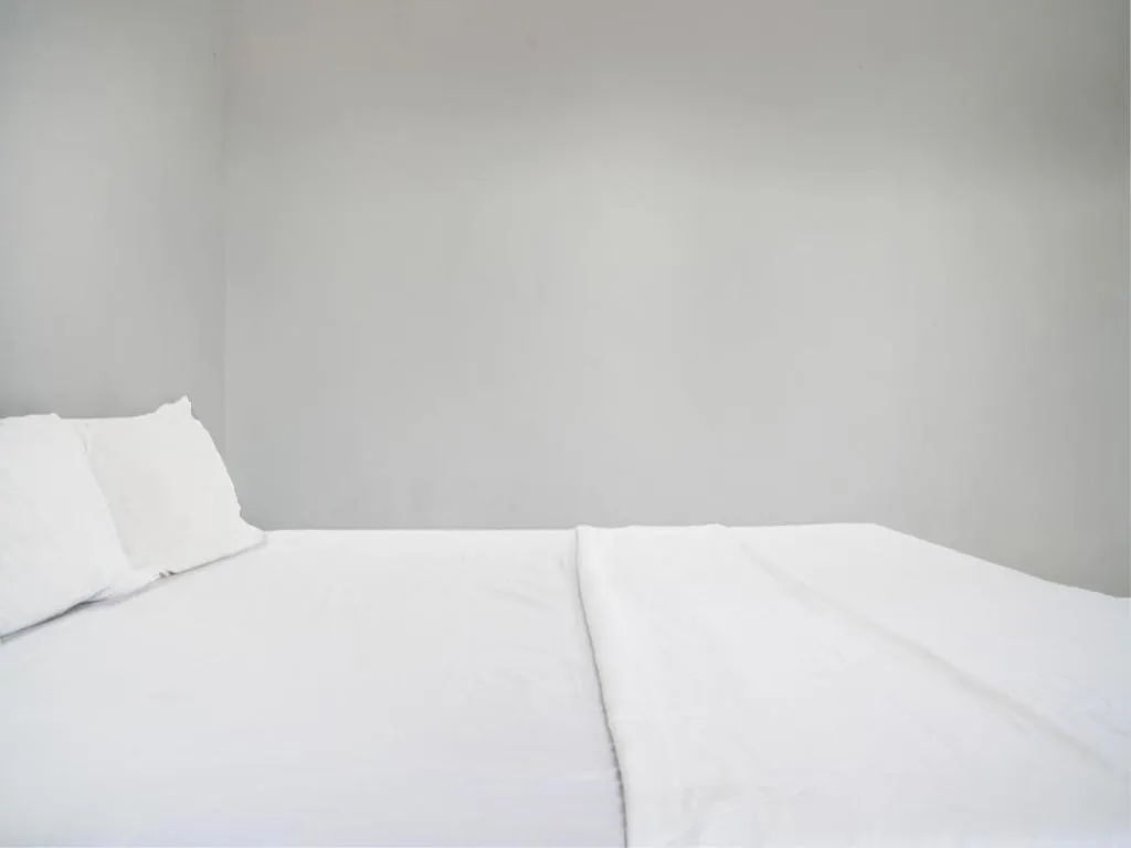 Bed in Hotel O Home Stay Syariah Aom Kusman