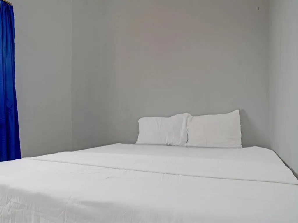 Bed in Hotel O Home Stay Syariah Aom Kusman