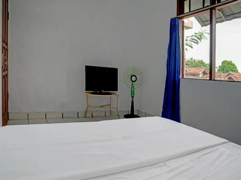 Bed in Hotel O Home Stay Syariah Aom Kusman