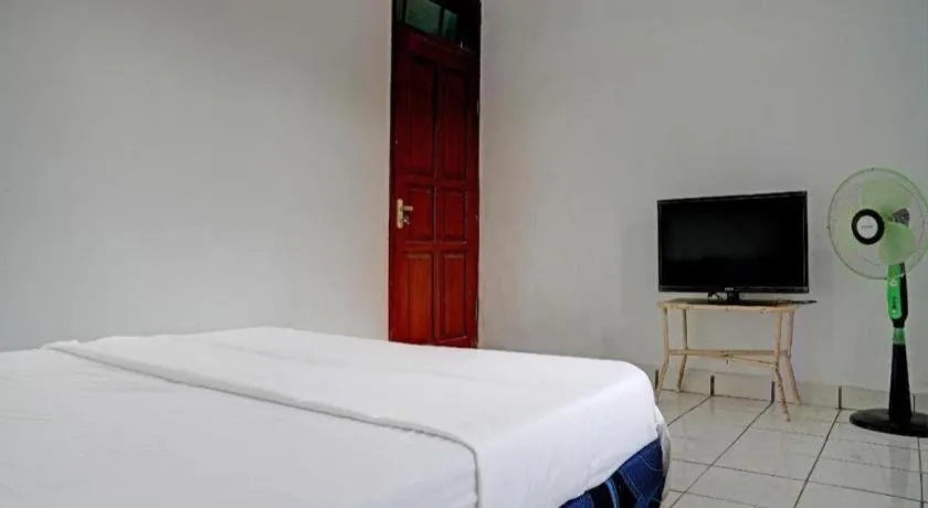 Bed in Hotel O Home Stay Syariah Aom Kusman