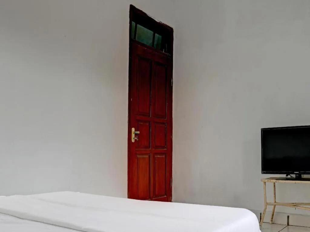 Bed in Hotel O Home Stay Syariah Aom Kusman