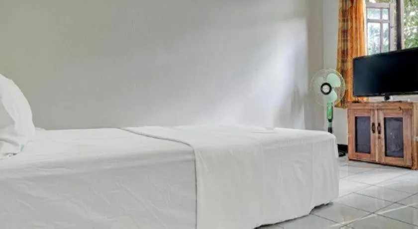 Bed in Hotel O Home Stay Syariah Aom Kusman