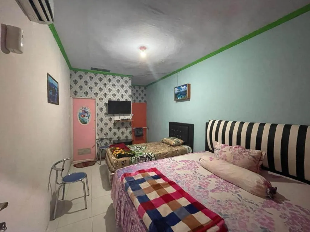 Bed in Hotel O Lima Saudara Syariah