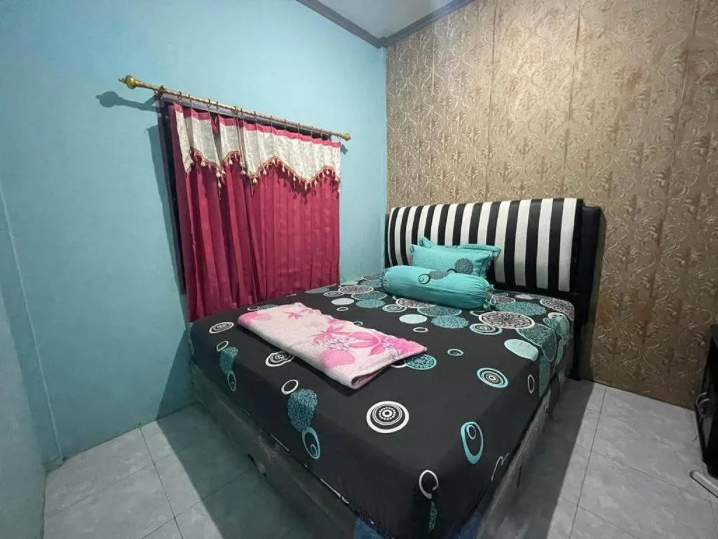 Bed in Hotel O Lima Saudara Syariah