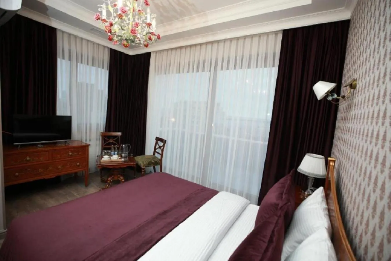 Bed in West Inn Hotel & Restaurant