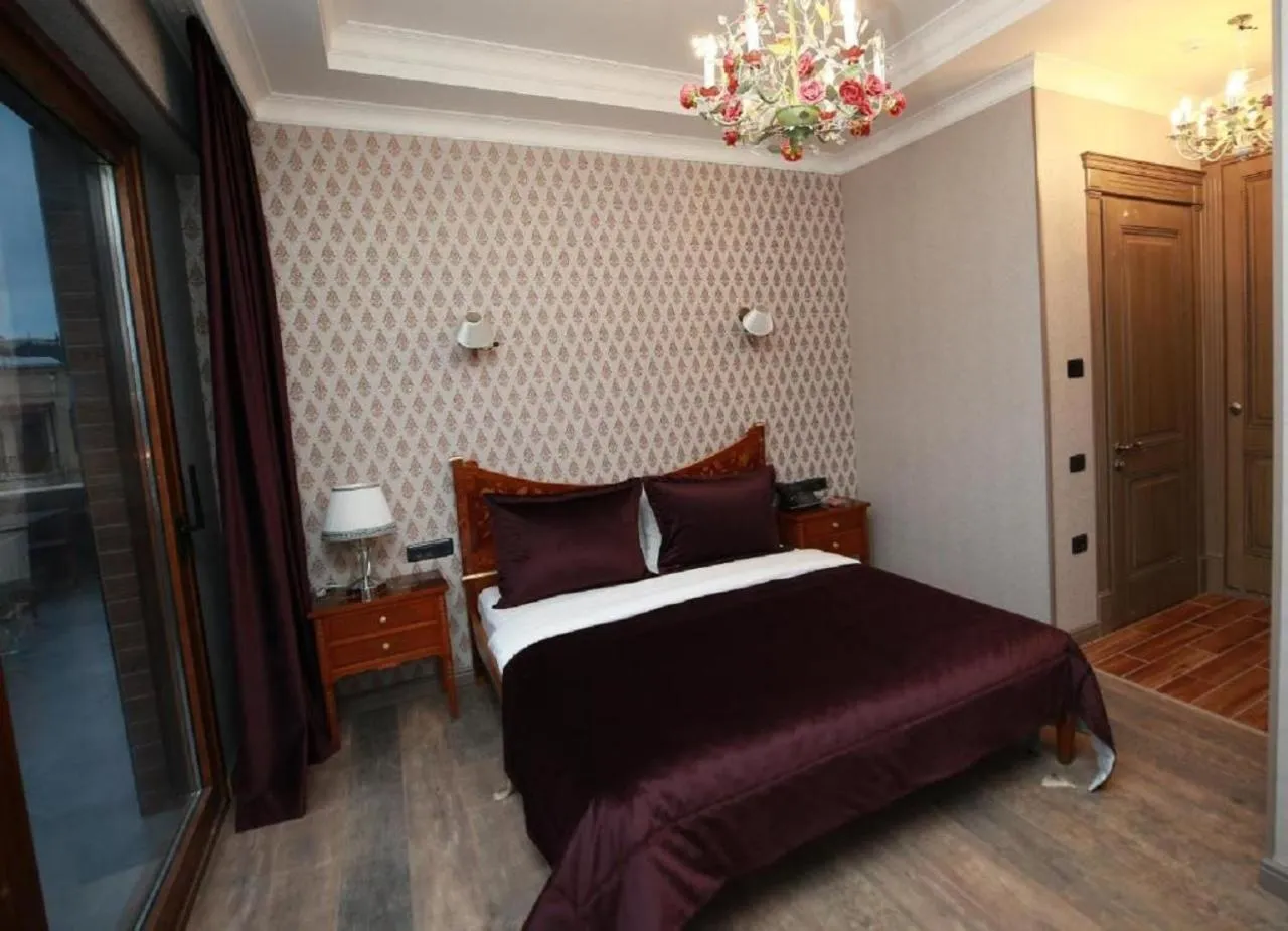 Bed in West Inn Hotel & Restaurant