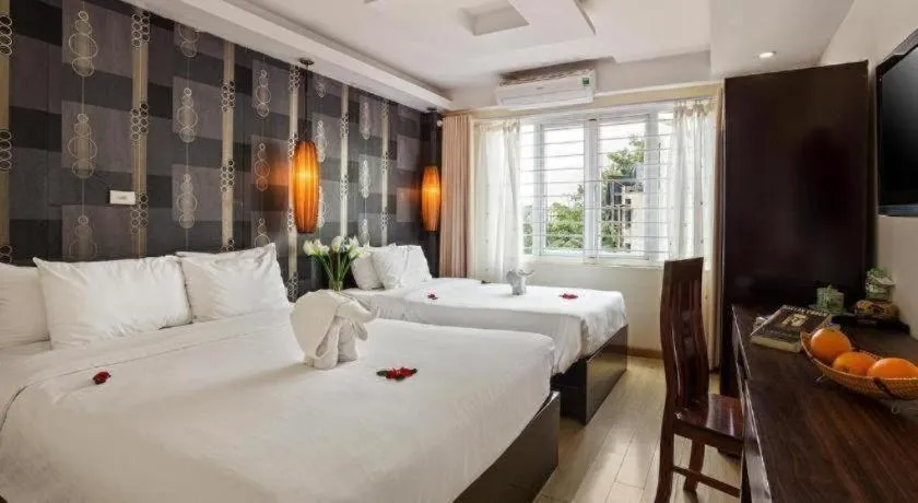 Bed in Hanoi Impressive Hotel