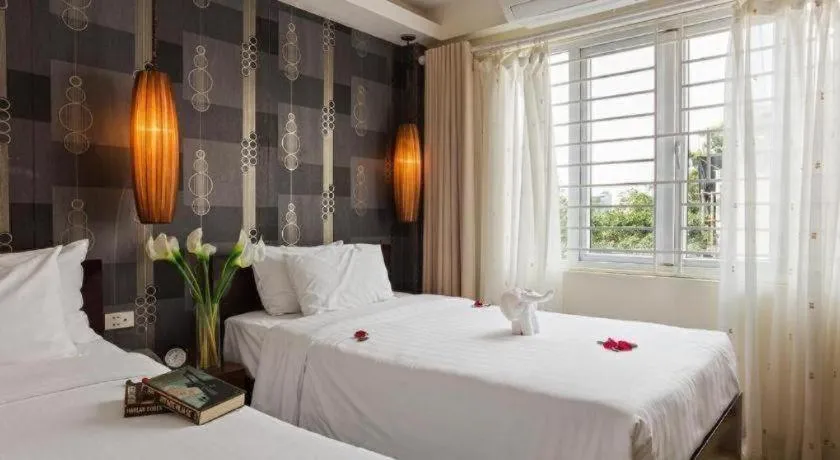 Bed in Hanoi Impressive Hotel