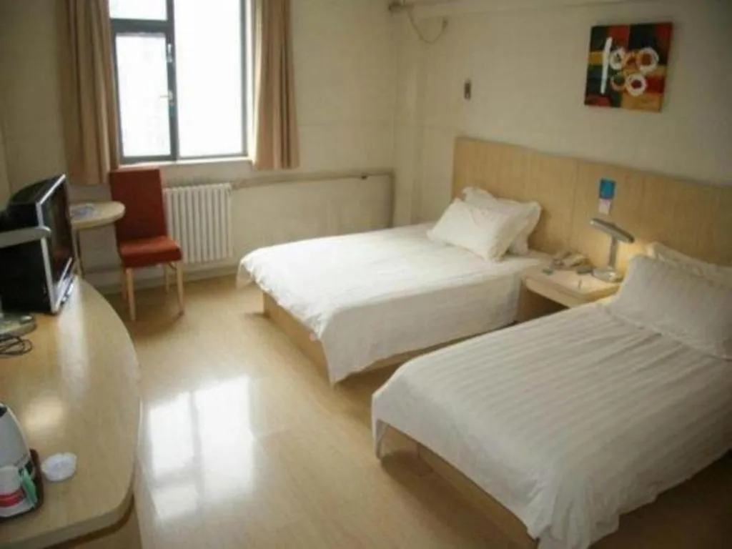 Bed in Jinjiang Inn Qingdao Hangzhou Rd.