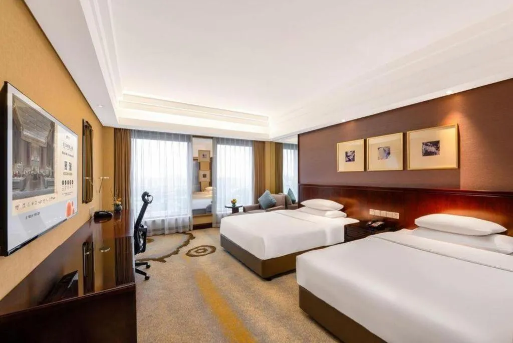 Bed in New Century Hangzhou Grand Hotel