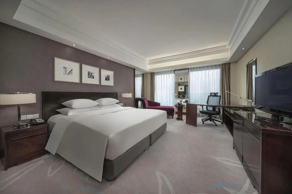 Bed in New Century Hangzhou Grand Hotel