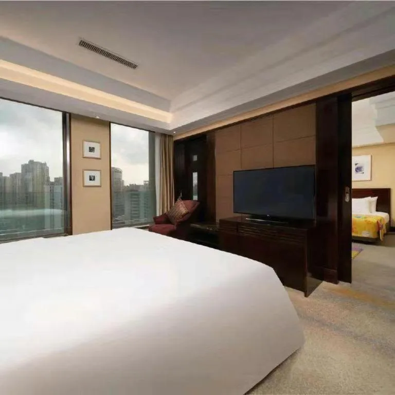 Bed in New Century Hangzhou Grand Hotel