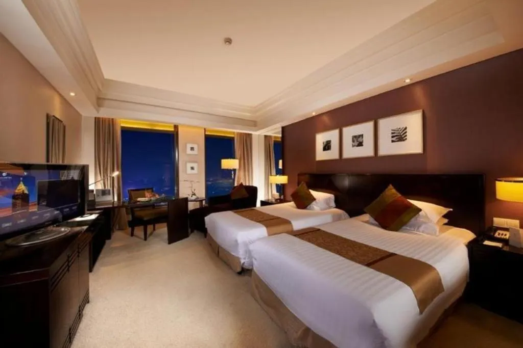 Bed in New Century Hangzhou Grand Hotel