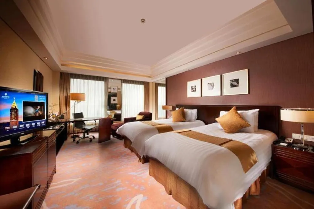 Bed in New Century Hangzhou Grand Hotel
