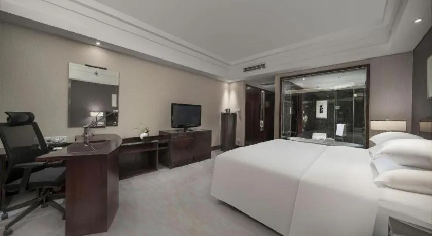 Bed in New Century Hangzhou Grand Hotel