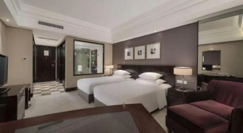 Bed in New Century Hangzhou Grand Hotel