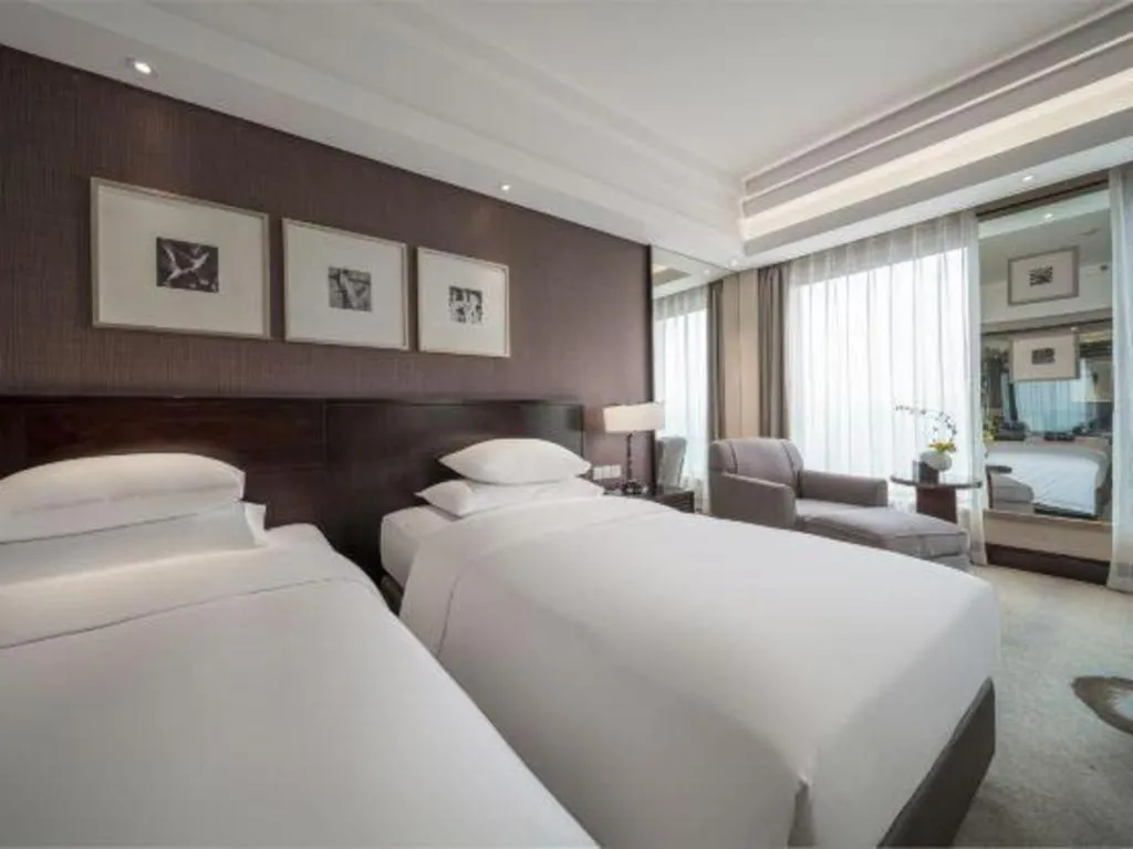 Bed in New Century Hangzhou Grand Hotel