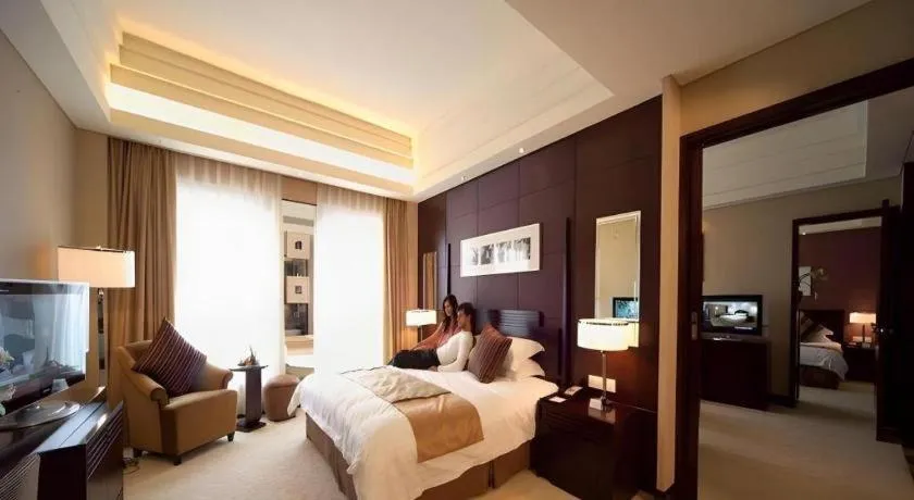 Bed in New Century Hangzhou Grand Hotel