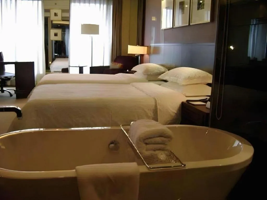 Bed in New Century Hangzhou Grand Hotel