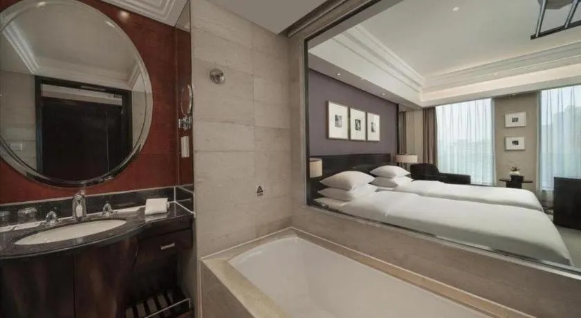 Bed in New Century Hangzhou Grand Hotel