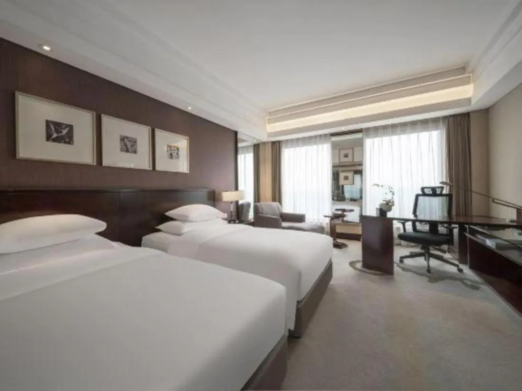 Bed in New Century Hangzhou Grand Hotel