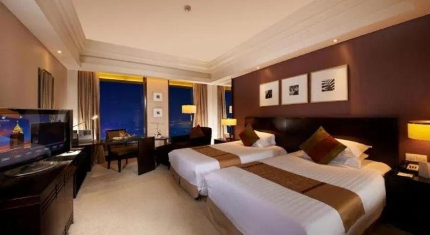 Bed in New Century Hangzhou Grand Hotel