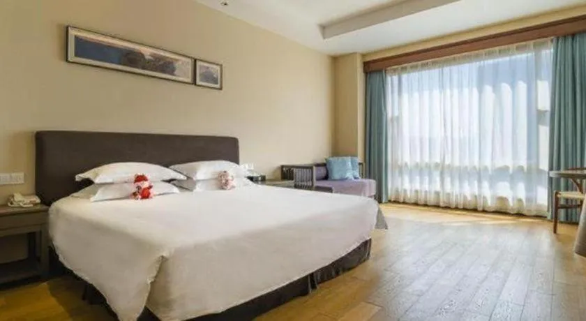 Bed in New Century Hotel Ninghai