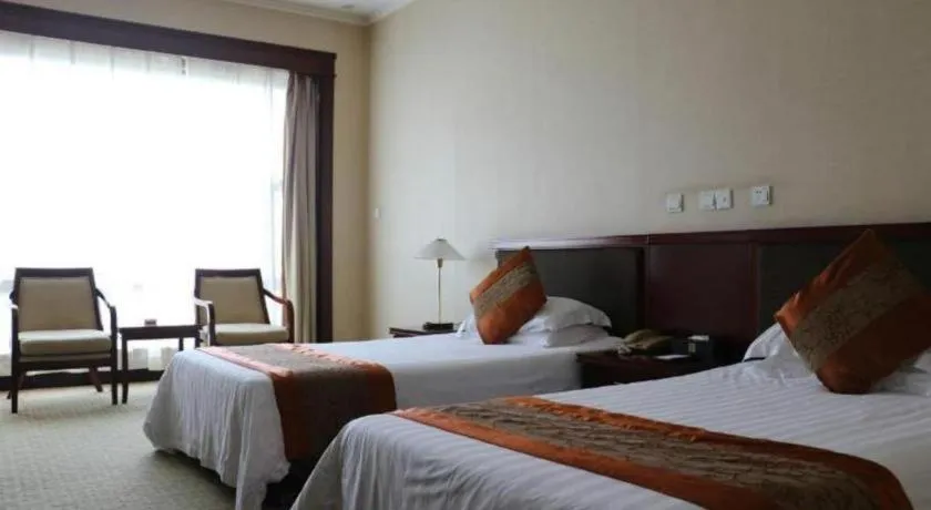 Bed in New Century Hotel Ninghai