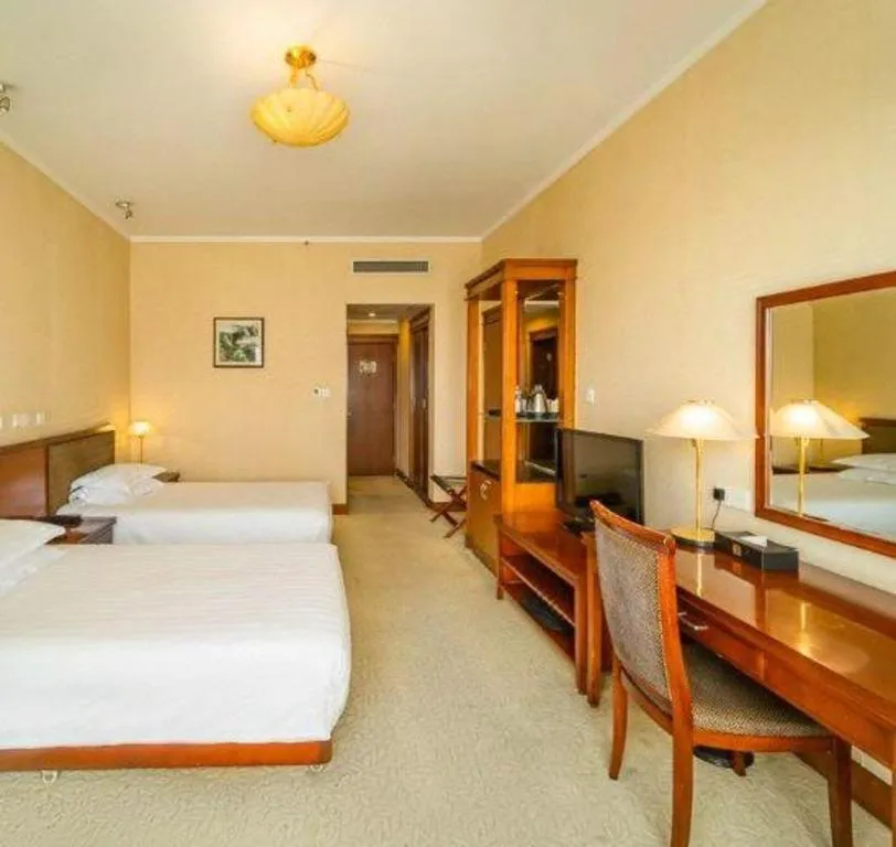 Bed in New Century Hotel Ninghai