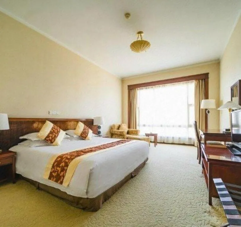 Bed in New Century Hotel Ninghai