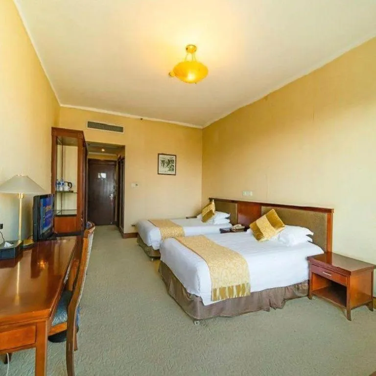 Bed in New Century Hotel Ninghai