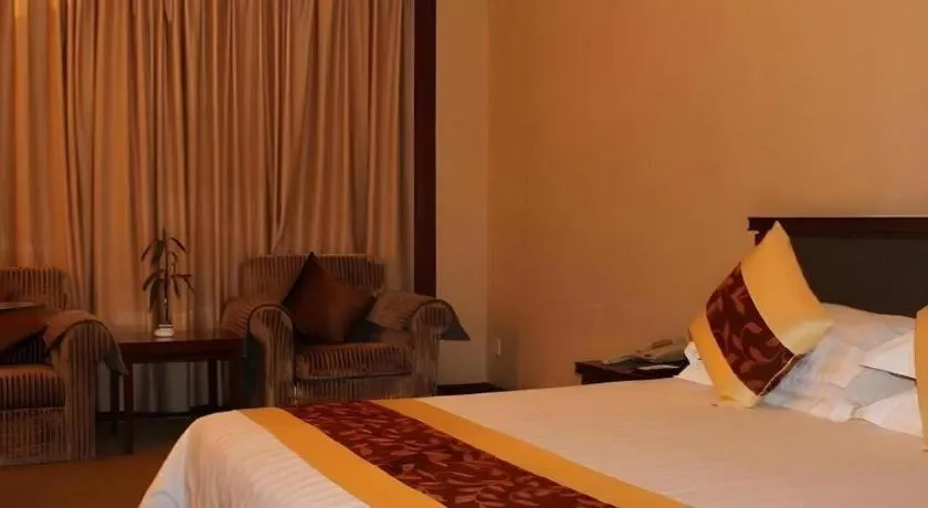 Bed in New Century Hotel Ninghai